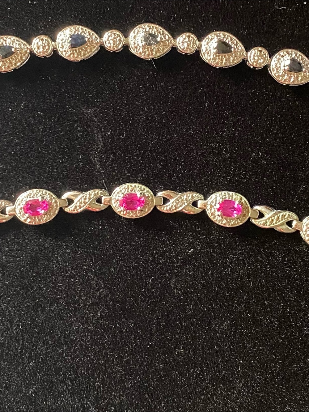 1 Gold-Tone Bracelet with Pink Gem Accents and 1 Silver Tone Bracelet both stamp